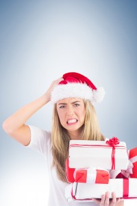 Festive blonde holding pile of gifts